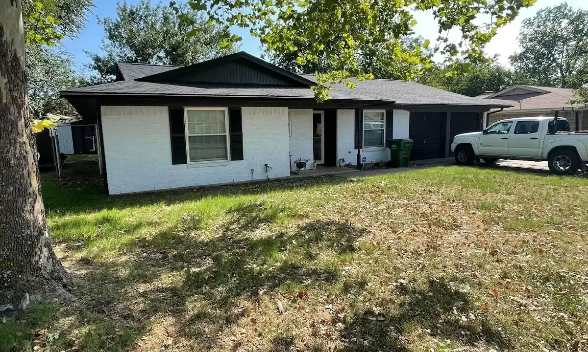 Professional roofing crew working on a residential roof in Cookeville
